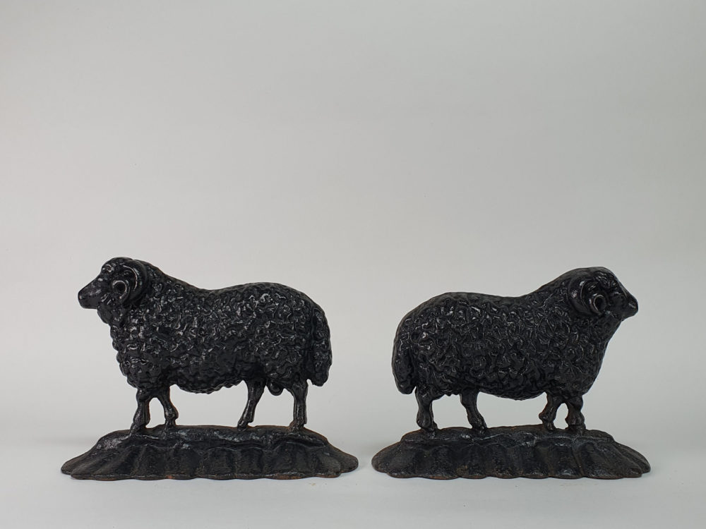Antique cast iron matched pair of male and female Black Sheep