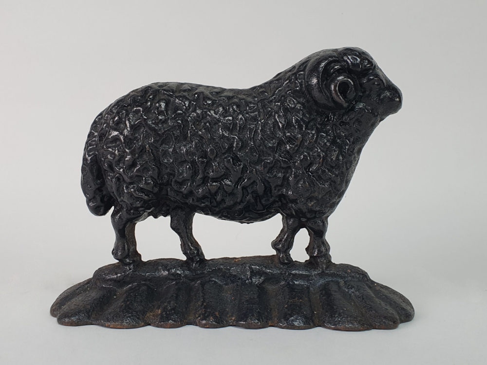 Antique cast iron matched pair of male and female Black Sheep