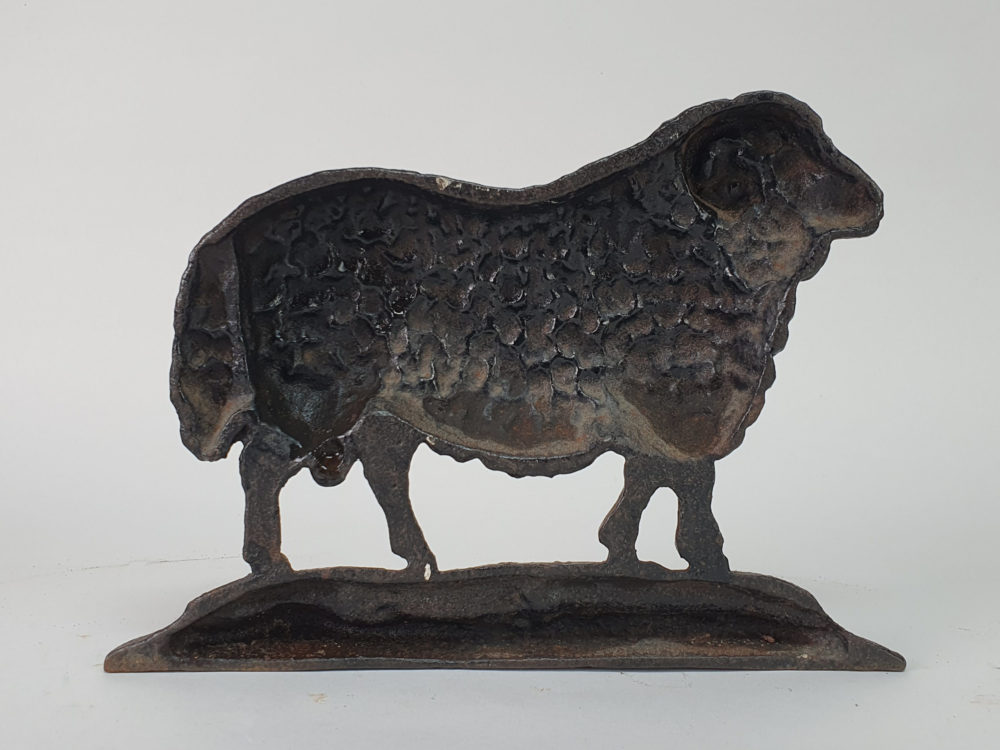 Antique cast iron matched pair of male and female Black Sheep