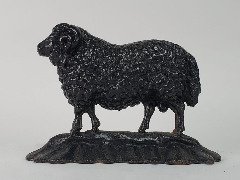 Antique cast iron matched pair of male and female Black Sheep