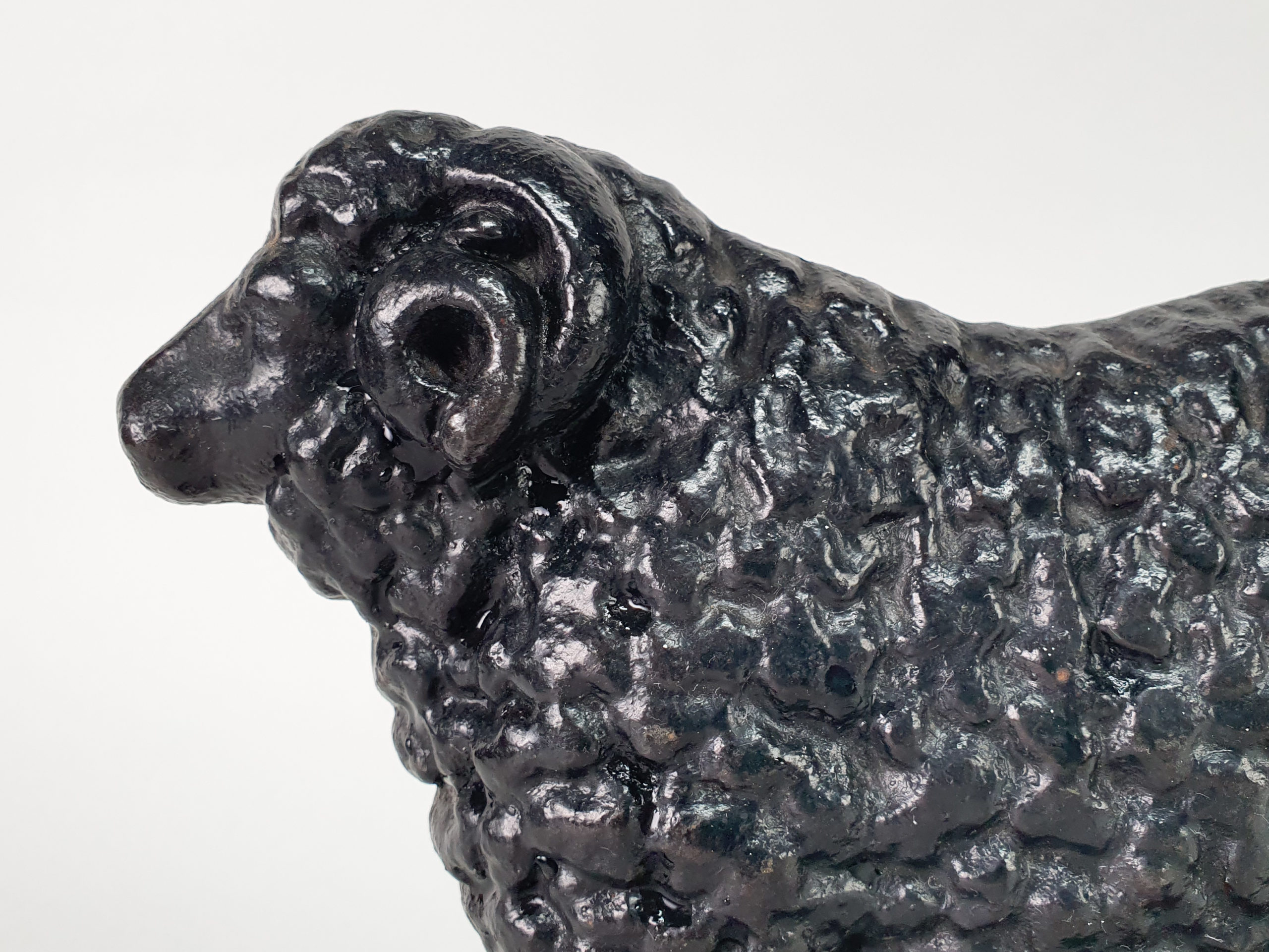 Antique cast iron matched pair of male and female Black Sheep