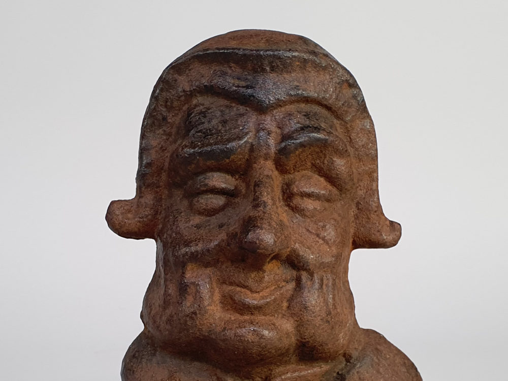 Cast iron antique Doorstop of a smiling Georgian gentleman's face