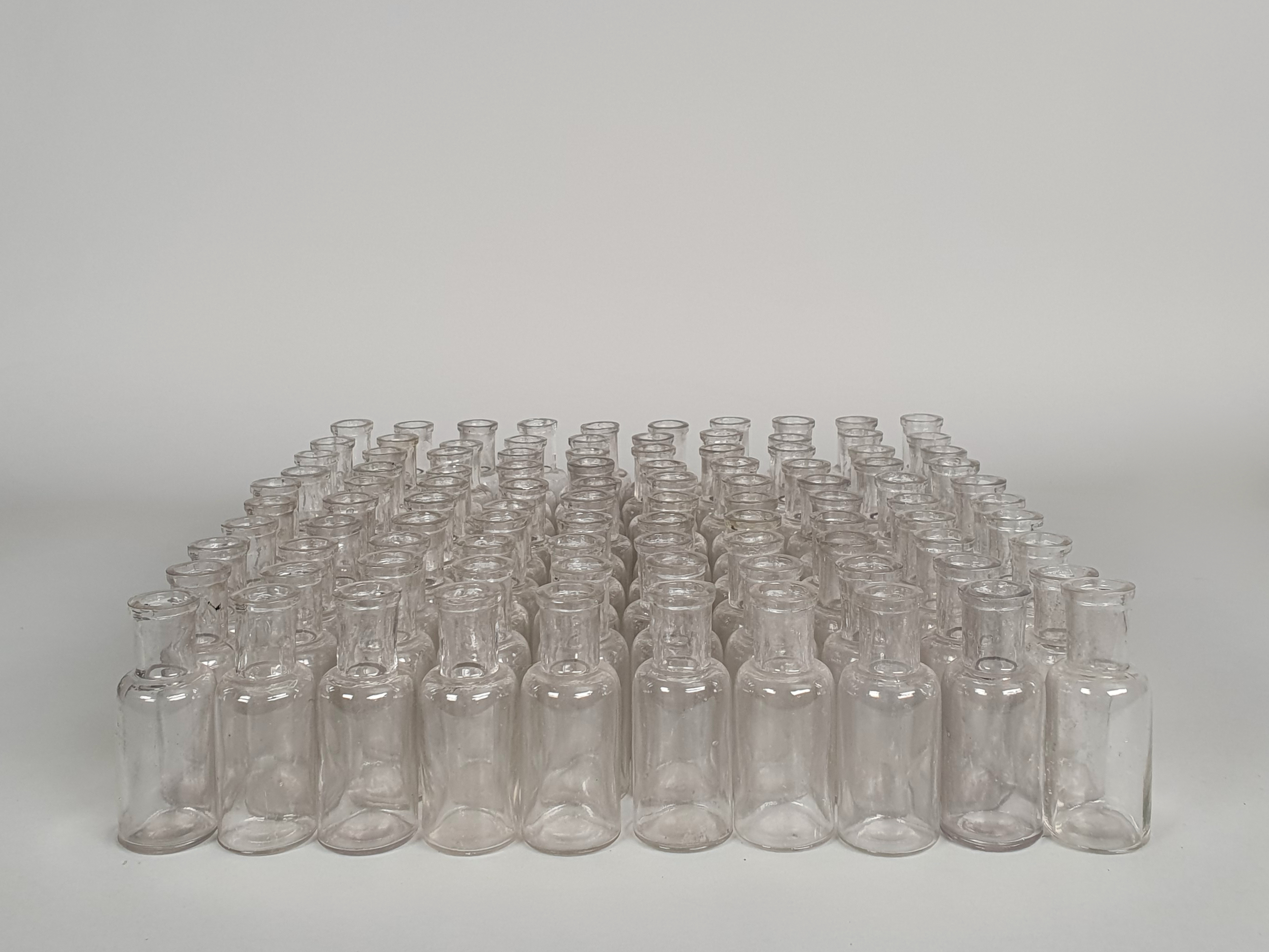 100 antique glass apothecary bottles wide shot