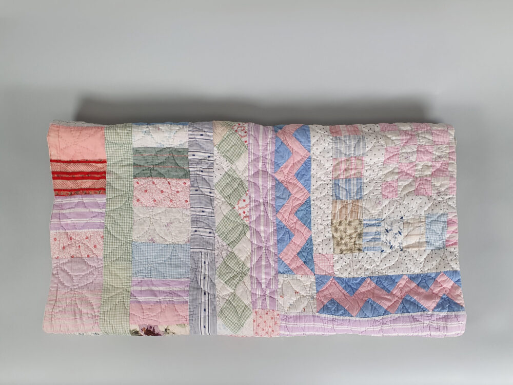 Handstitched patchwork antique Quilt in pastel colours