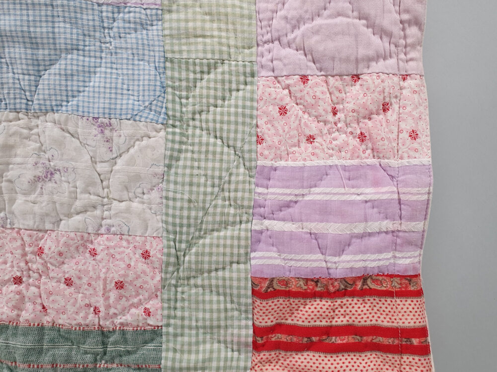 Handstitched patchwork antique Quilt in pastel colours
