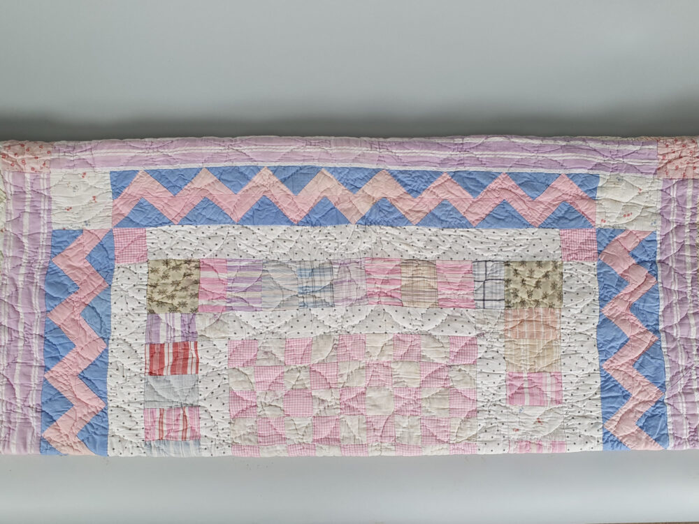Handstitched patchwork antique Quilt in pastel colours