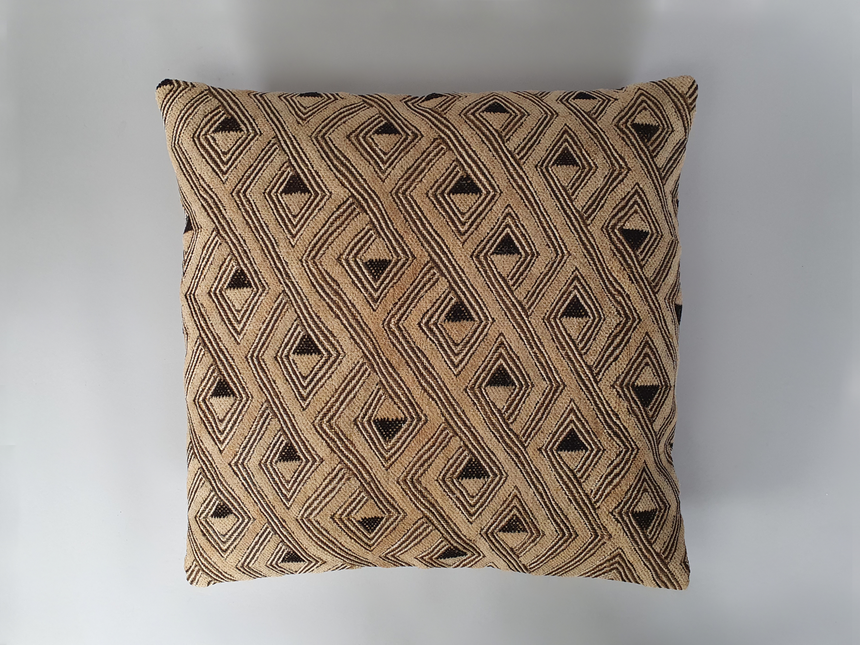 kuba cloth antique cushion wide shot