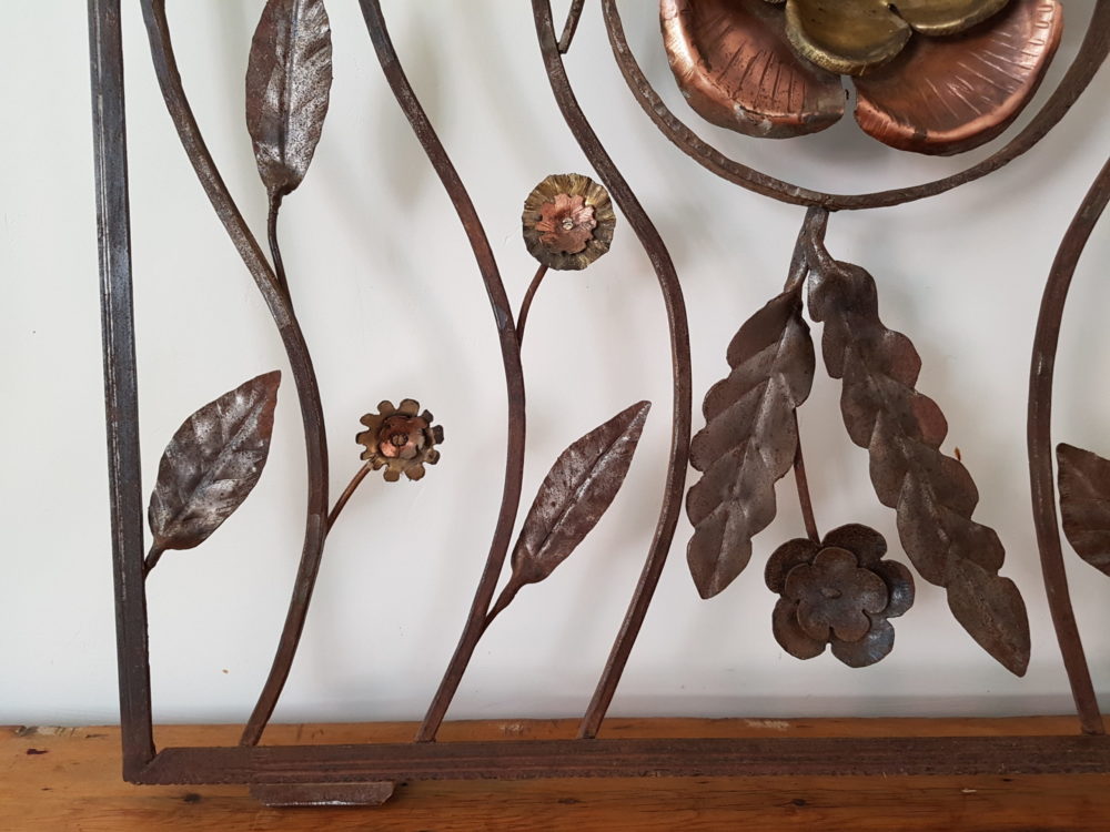 Mid century antique wrought iron sculpture with a copper Flower