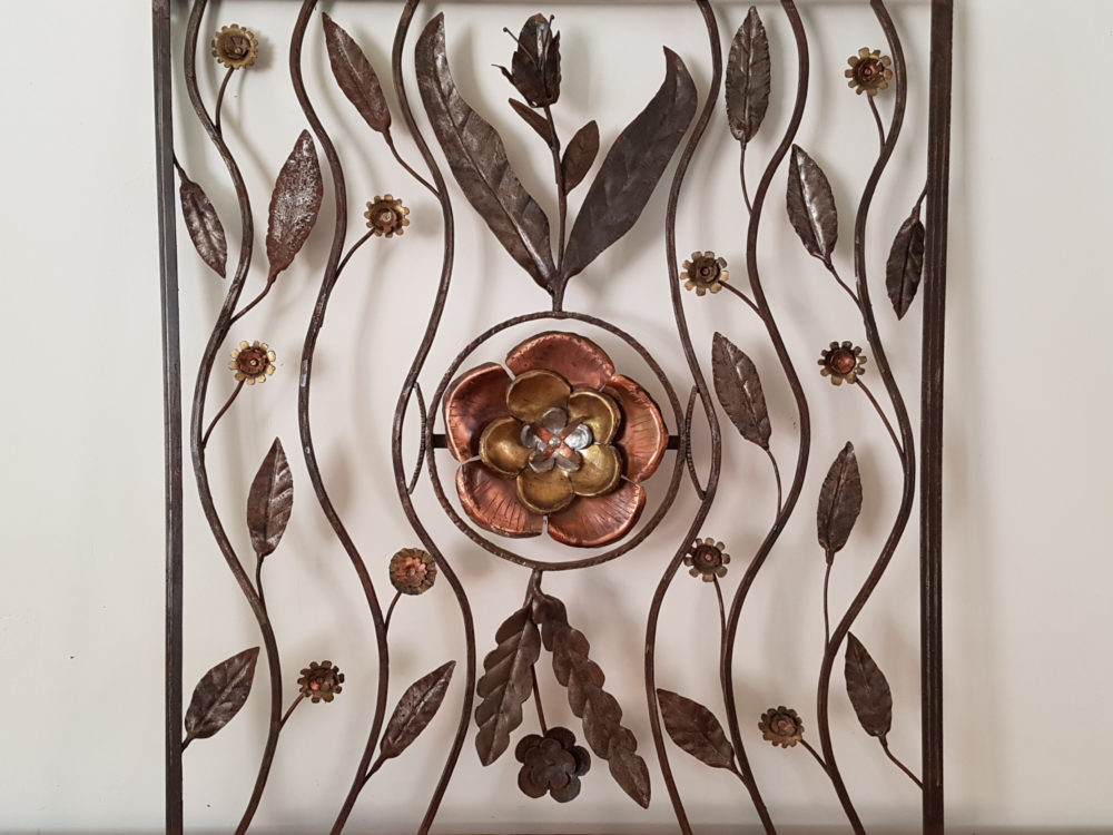 Mid century antique wrought iron sculpture with a copper Flower