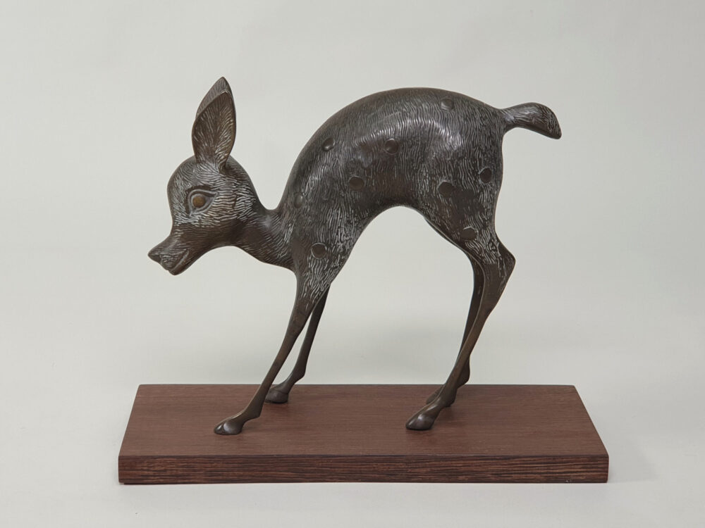 Pair of mid century decorative antique Deer and Fawn Statutes, on wenge plinths