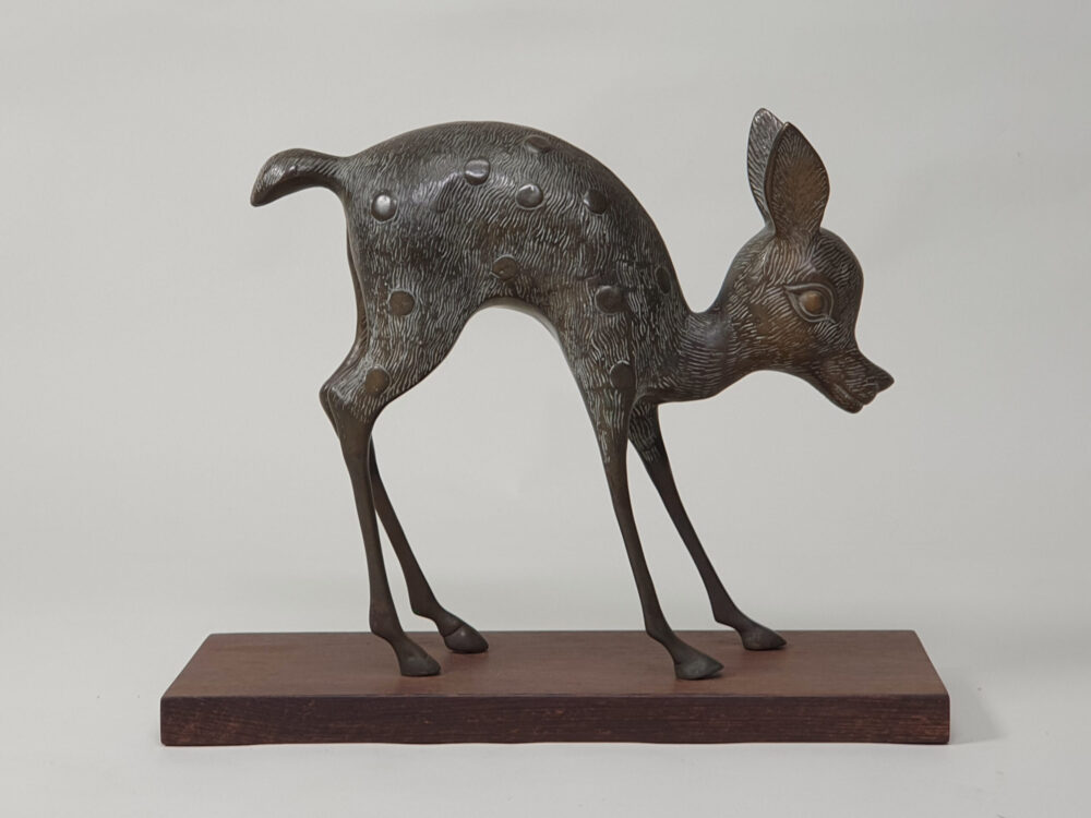 Pair of mid century decorative antique Deer and Fawn Statutes, on wenge plinths