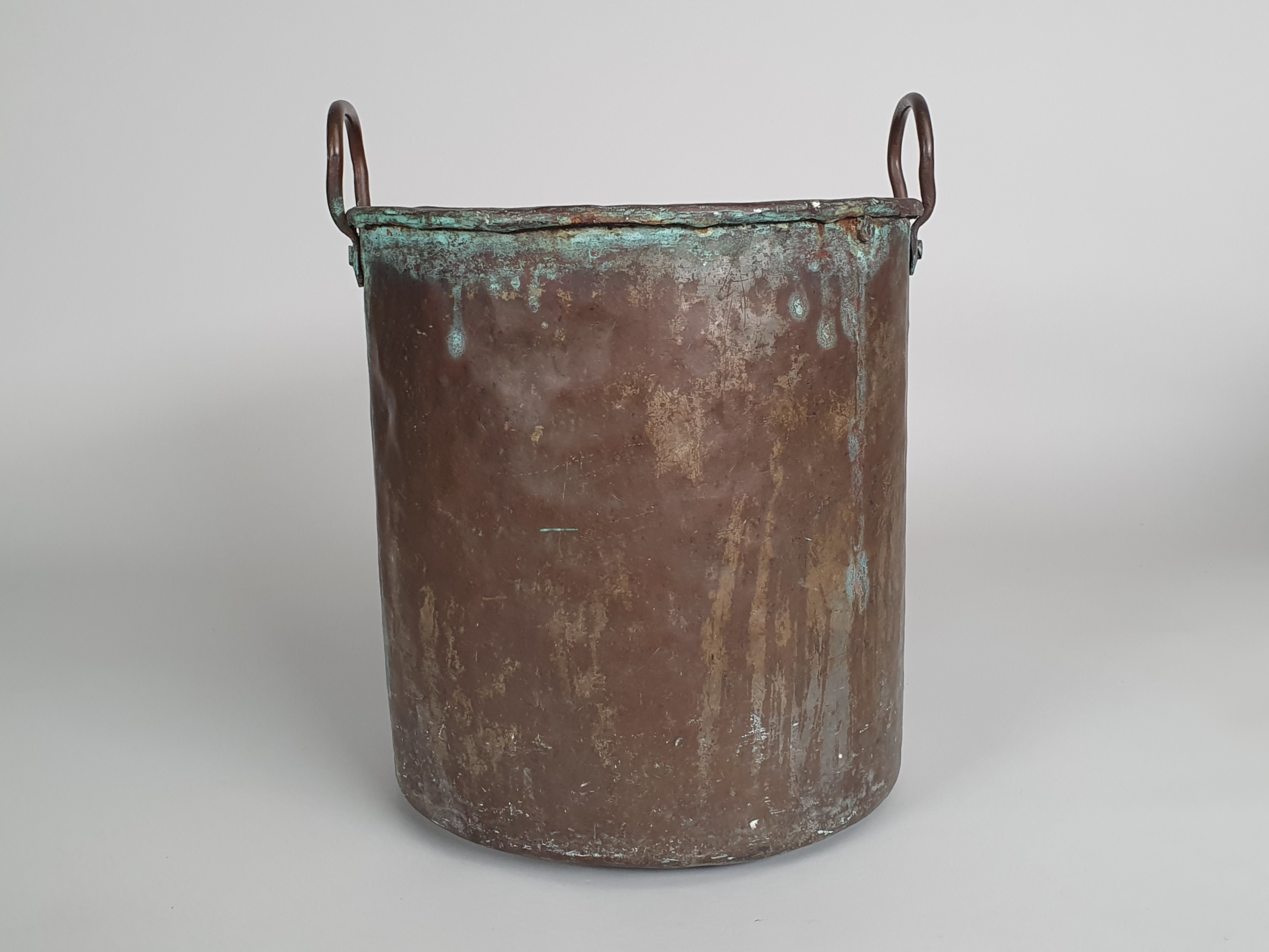 Rustic antique riveted Copper Bucket wide shot