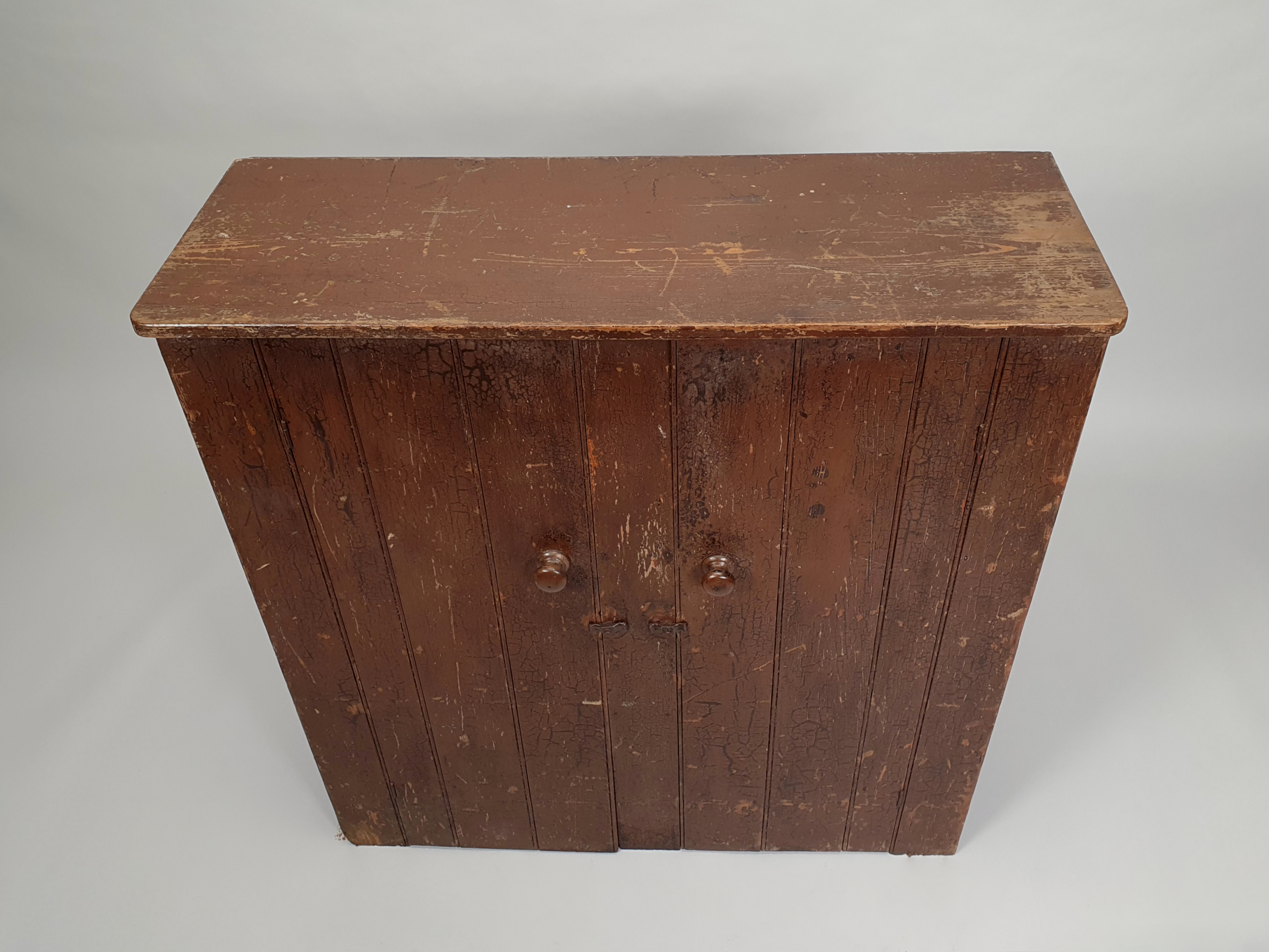antique wall cupboard view of top ledge